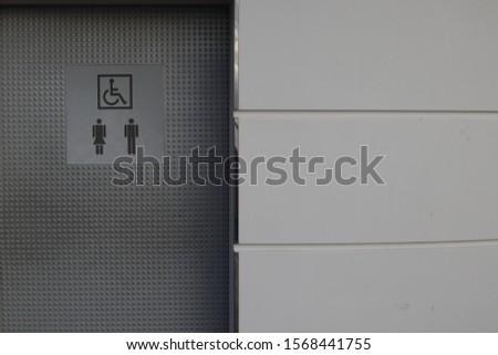 Close up of doors of a public street toilet cubicle