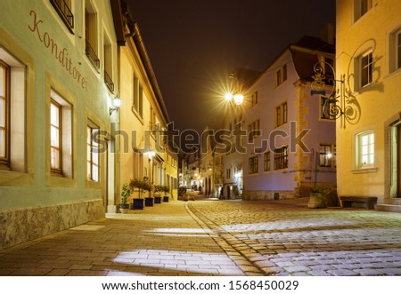 Rothenburg ob der Tauber in Bavaria, Germany at night. The word "Konditorei" in this photo is a simple German word for a cake shop.
