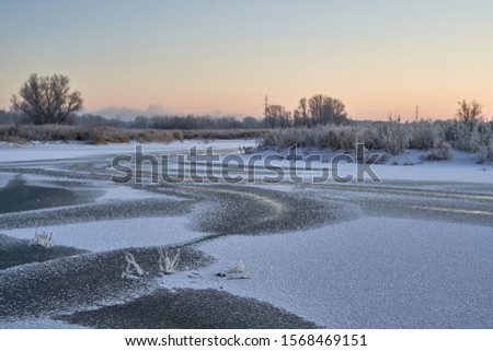 The first November frosts, bound lakes and rivers with ice. Pezinok. The snow is silver in the sun.