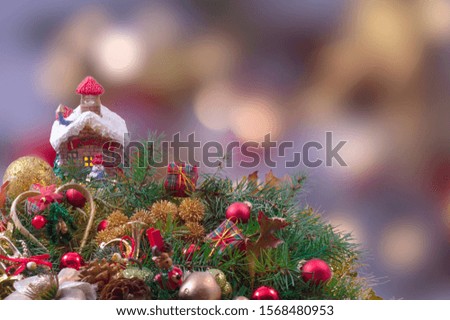 Christmas decorations with red balls and out focus lights background