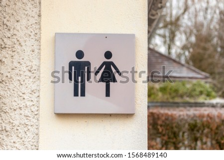 Toilet sign with man and woman
