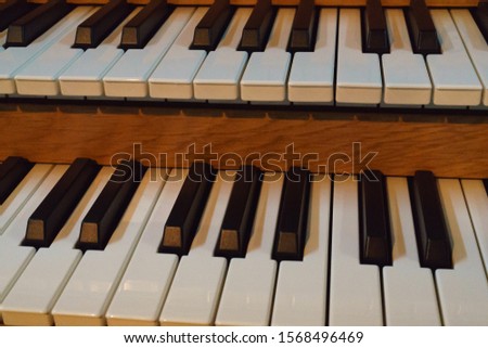 Photography of a fragment of modern  musical organ.