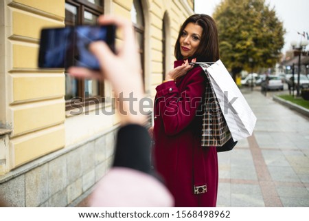 Mother and daughter, photographed after shopping