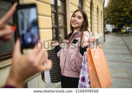 Mother and daughter, photographed after shopping