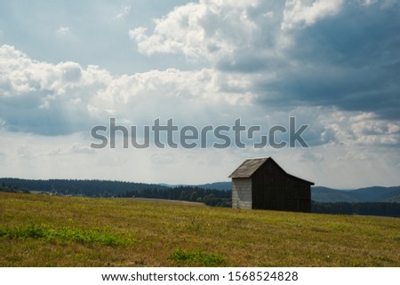 landscape with meadow and barn 