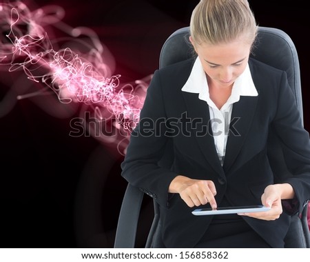 Composite image of businesswoman sitting on swivel chair with tablet on black background with glowing pink lightening