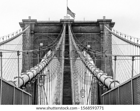 Close up details of the Brooklyn Bridge on a cloudy day