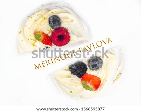 Meringue Pavlova with cream and fresh berries, strawberries, raspberries, blueberries isolated on white, copy space, selective focus