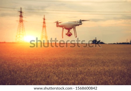 drone with a video camera in the vicinity of electric lines
