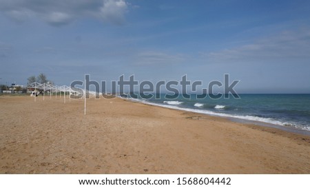 Sandy beach on the Black Sea near Feodosia, Republic of Crimea, Russia Royalty-Free Stock Photo #1568604442