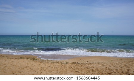 Sandy beach on the Black Sea near Feodosia, Republic of Crimea, Russia Royalty-Free Stock Photo #1568604445