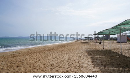 Sandy beach on the Black Sea near Feodosia, Republic of Crimea, Russia Royalty-Free Stock Photo #1568604448