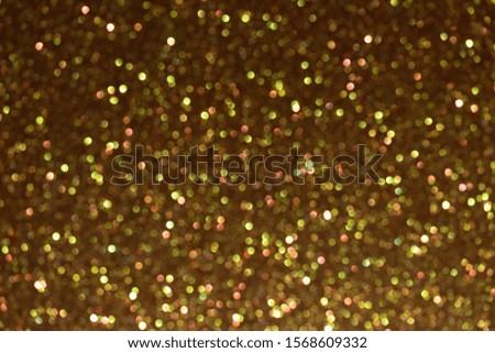 Glitter golden  background, de-focused. Sparks fall and sparkle.
