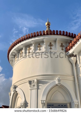 Photo from beautiful round public neoclassic tower building in Kifisia district on a blue cloudy sky, North Athens, Attica, Greece