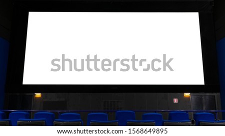 large Billboard in the form of a cinema monitor, convey information through the screen in the cinema hall. large advertising layout. Royalty-Free Stock Photo #1568649895