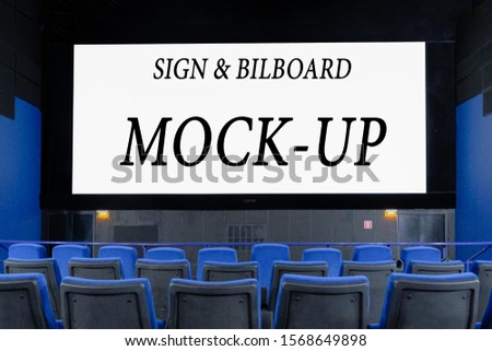 large Billboard in the form of a cinema monitor, convey information through the screen in the cinema hall. large advertising layout. Royalty-Free Stock Photo #1568649898