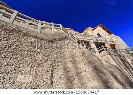 Walkways-Mogao Buddhist caves comprising 492 caves and cell temples in the South section-several open for tourist visit housing Buddhist art from centuries 4th to 14th. Dunhuang-Gansu province-China.