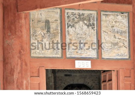Door lintel panels depicting Buddhist scenes-9 story high wooden porch of cave 96-Mogao Caves S.area comprising 492 caves and cell temples dating from centuries 4th to 14th. Dunhuang-Gansu prov.-China
