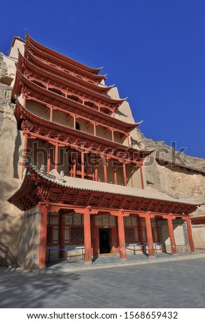 9 story high wooden porch of cave 96-Mogao Caves S.section comprising 492 caves and cell temples-some open for tourist visit housing Buddhist art from centuries 4th to 14th. Dunhuang-Gansu prov.-China