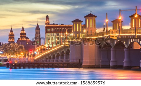 St. Augustine, Florida, USA city skyline and Bridge of Lions at dusk.