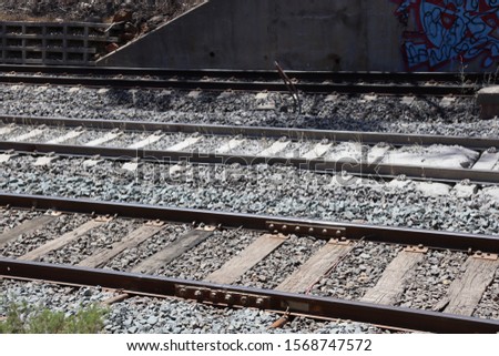 Railway lines in country Victoria, Australia showing Victorian gauge of 5 foot 3 inches in foreground with Australian standard gauge 4 ft 8 1⁄2 inches in background