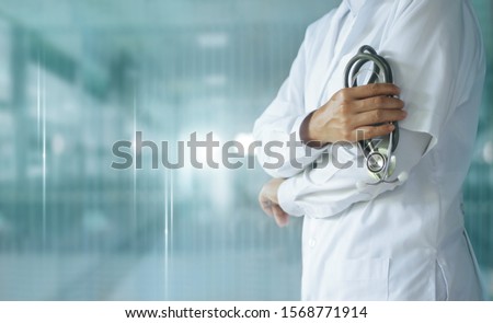 Medicine doctor with stethoscope in hand on hospital background,  Medical technology, Healthcare and Medical concept. Royalty-Free Stock Photo #1568771914