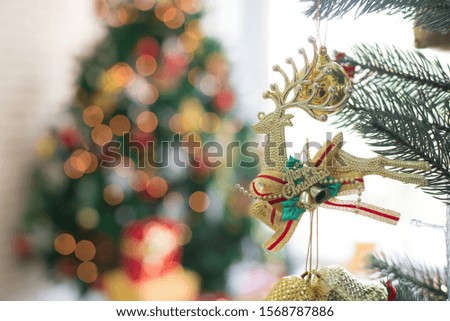 Christmas tree decoration picture With reindeer doll, bokeh light background