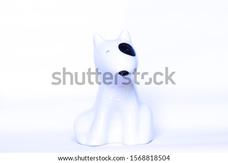 Ceramic dog is on white background.