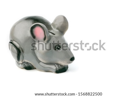 One Piggy Bank in the form of a gray mouse, a rat stands on a white isolated background ignature. Isolate