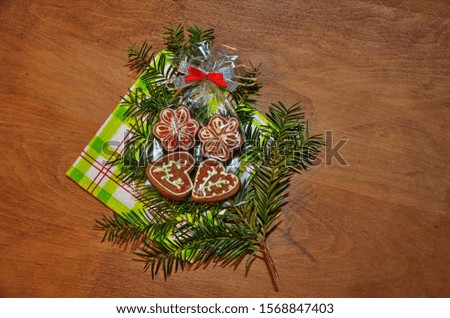 Ginger cookies lie on a wooden background. Christmas sweetness.