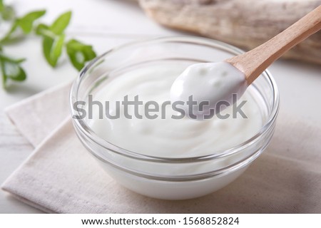Fresh yogurt on the table Royalty-Free Stock Photo #1568852824