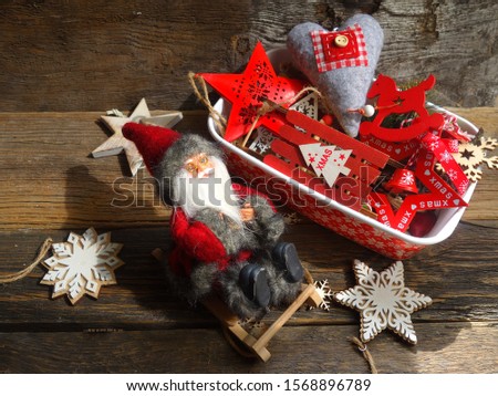 Decorations on the Christmas tree in wooden bacground  - time to dress the Christmas tree - figurines, toys, hanging, stars