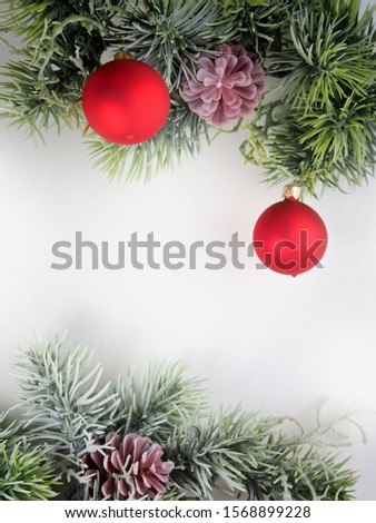 New Year picture. Spruce branch with Christmas toys on a white background.