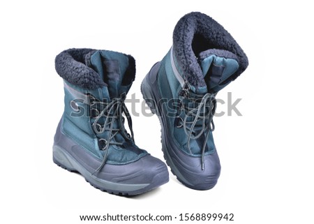 specialized shoes, off-road boots warmed for the cold season, high shin, lacing, anti-slip corrugated reinforced sole for travel and winter fishing isolate on a white background close-up