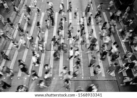 Busy pedestrian crossing at Hong Kong Black and White