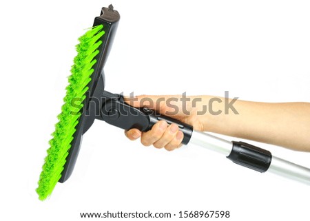 stylish brush in hand for car winter snow on a white background