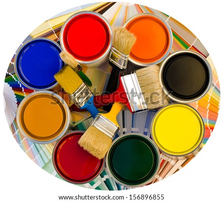 Different color cans of paint and brushes on swatches background. Top view on a circle of paint cans. Round photo.