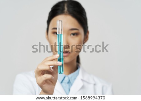 Blue liquid medical coat beautiful woman Asian appearance