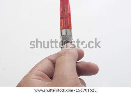 electric cigarette in human hand isolated on white