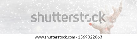 Silver glitter Christmas deer on white background with lights bokeh. Greeting card, banner. holiday concept. Panorama picture