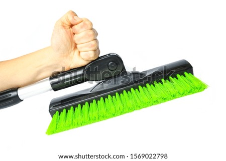 stylish brush in hand for car winter snow on a white background