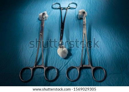 medical instruments close-up on a sterile diaper. present lighting with operating lamps