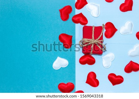 Background for Valentine's day with gifts and hearts. Place for inscription and congratulations on Valentine's Day. Horizontal top view, flat lay.