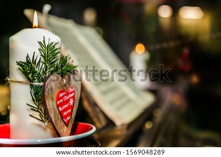 Old piano with candles and christmas decoration.Christmas time. Close up