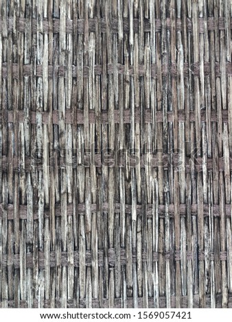 The texture is light. Weaving from straws of different shades of gray.
