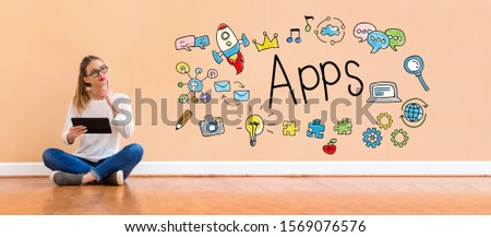 Apps with young woman holding a tablet computer