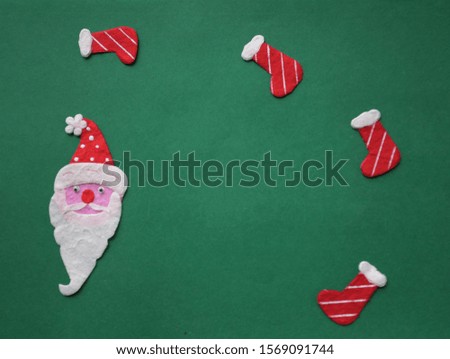 gift box ,candy and Santa Claus on green background decorations for Christmas new year concept
