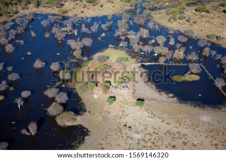 Aerial view of the Okavango Delta, Botswana. The vast inland delta is formed from the Okavango River. This flows into the Delta , creating a beautiful mosaic of water channels, grasslands and lagoons.