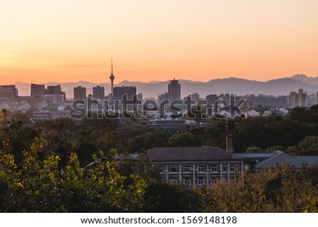 Panoramic view of Beijing from a viewpoint at sunset, on a clear day, China