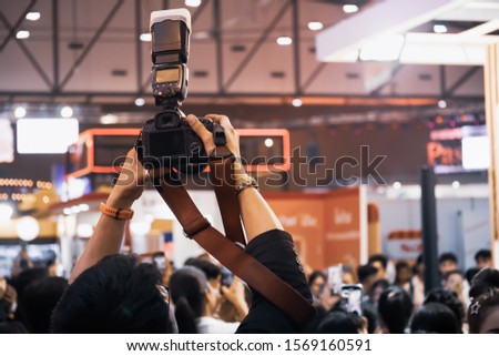 Professional photographers are taking photos by the event.